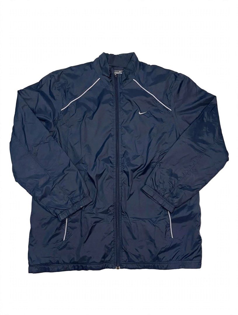 Nike Navy Blue Track Jacket XL (Category: Coats, Jackets and Outerwear) located in Santa Maria. Submitted by lftgcollective (Listing ID 1463911027, Image 1). Description: - Navy blue Nike track jacket - Size XL - Zip-up front with stand-up collar - White piping details on shoulders and sleeves - Two side pockets - Made in China.