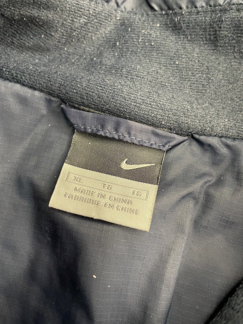Nike Navy Blue Track Jacket XL (Category: Coats, Jackets and Outerwear) located in Santa Maria. Submitted by lftgcollective (Listing ID 1463911027, Image 3). Description: - Navy blue Nike track jacket - Size XL - Zip-up front with stand-up collar - White piping details on shoulders and sleeves - Two side pockets - Made in China.