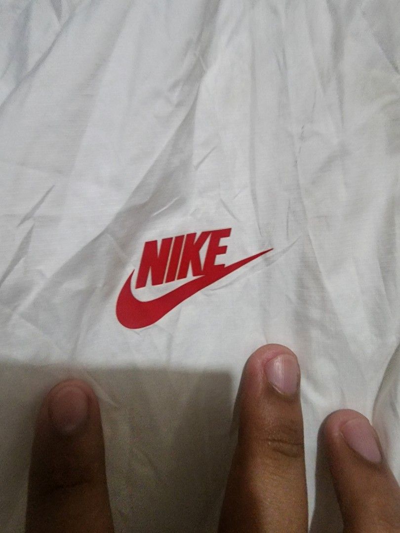 Nike Paris SaintGermain White Windbreaker (Category: Coats, Jackets and Outerwear) located in Tanza. Submitted by coki27 (Listing ID 1463876793, Image 3). Description: - White Nike windbreaker jacket - Features PSG logo - Red and blue accents on sleeves - Large navy swoosh on the back - Full zip front with hood - Size: Small on tag -Selling: 1,000 -Meetup/Pickup: Tanza Cavite -Shipping: LBC/JnT/LALAMOVE (add SF) TY 🫡🙌.