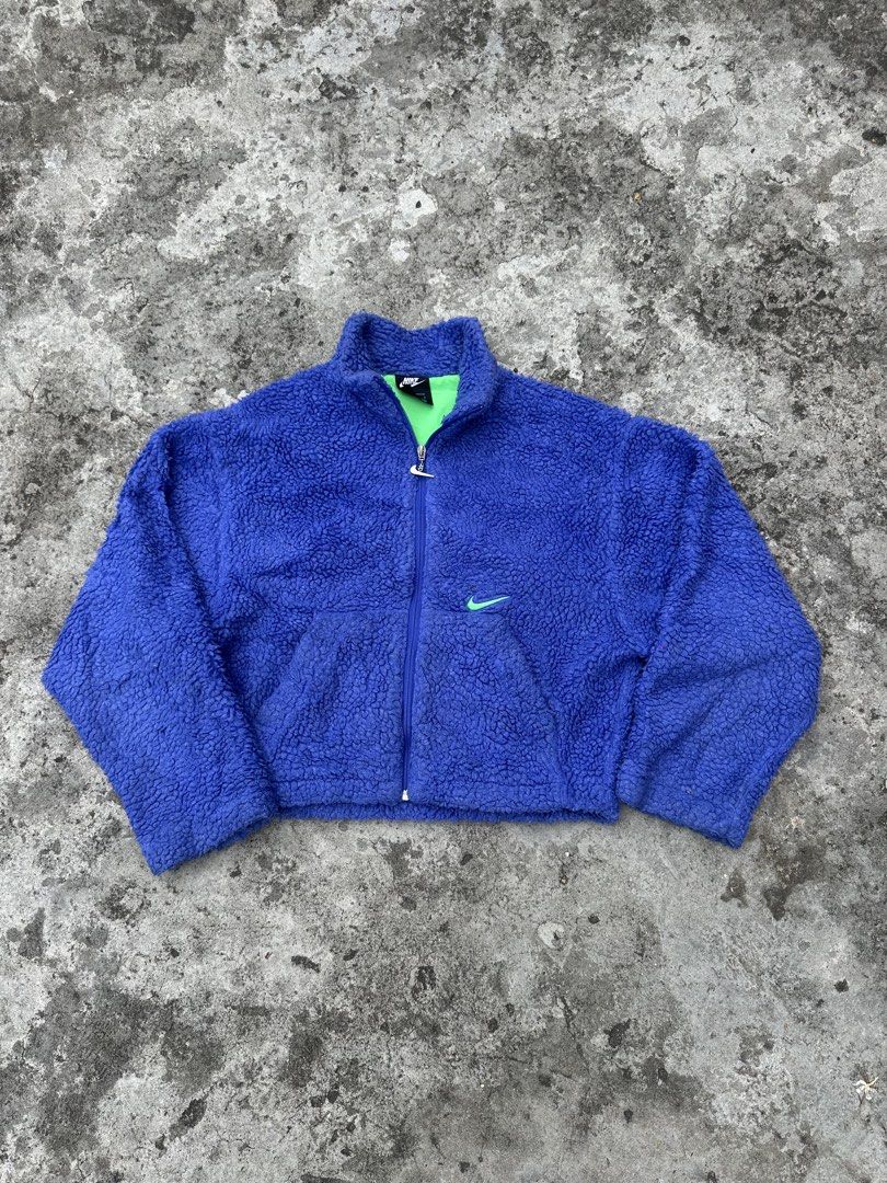 Nike purple Fleece Zip Up Jacket (Category: Coats, Jackets and Outerwear) located in Bago City. Submitted by thekasproject (Listing ID 1463823700, Image 2). Description: - Super cozy purple fleece jacket from Nike - Bright green lining - Small embroidered Nike swoosh on chest - Larger embroidered swoosh on back - Full zip closure with Nike branded zipper pull - Great for layering or wearing on its own.