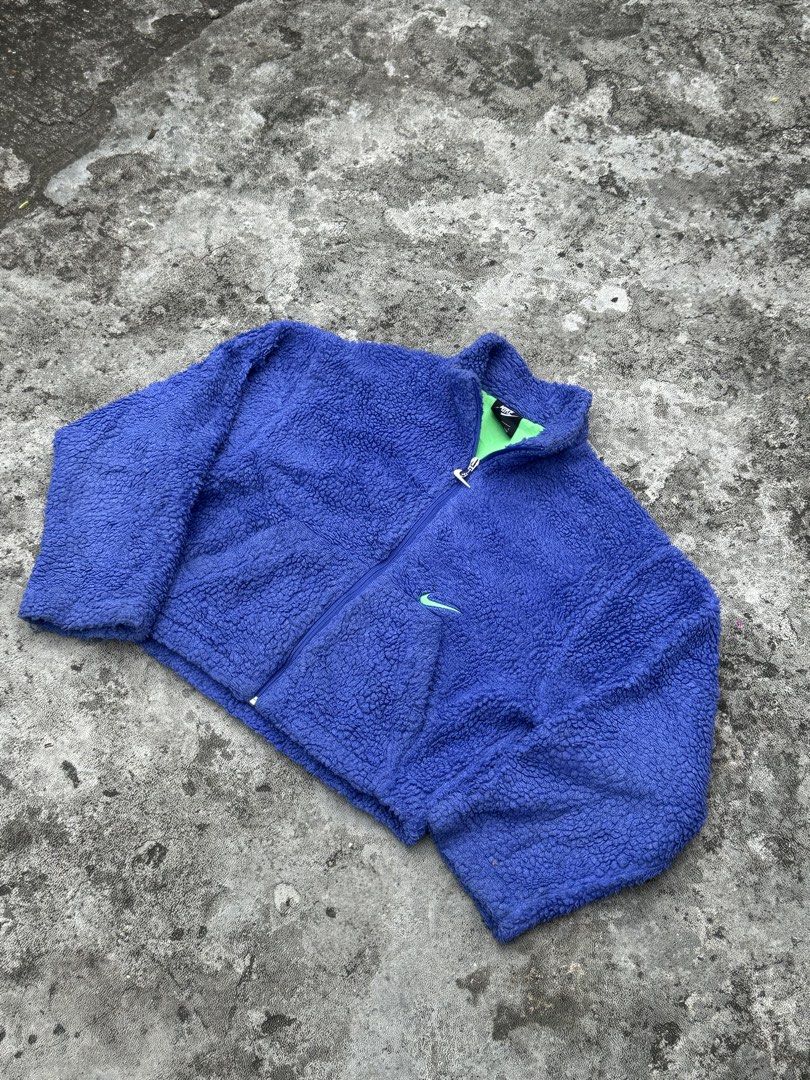 Nike purple Fleece Zip Up Jacket (Category: Coats, Jackets and Outerwear) located in Bago City. Submitted by thekasproject (Listing ID 1463823700, Image 1). Description: - Super cozy purple fleece jacket from Nike - Bright green lining - Small embroidered Nike swoosh on chest - Larger embroidered swoosh on back - Full zip closure with Nike branded zipper pull - Great for layering or wearing on its own.