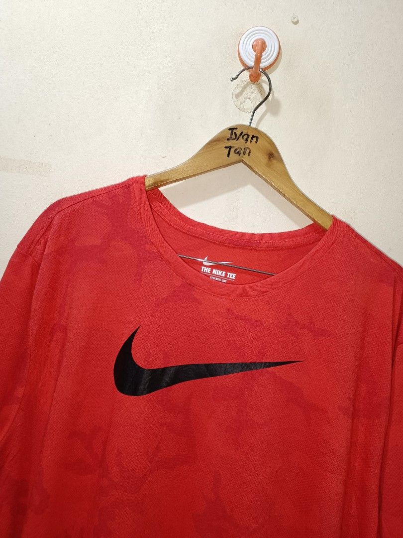 Nike Shirt (Category: Tshirts & Polo Shirts ) located in Makati City. Submitted by ivsseyow03 (Listing ID 1463748481, Image 2). Description: Red Nike t-shirt with a large black swoosh logo. Subtle camouflage pattern all over. Dri-FIT material for comfort. Size 2XL. Great for workouts or casual wear..