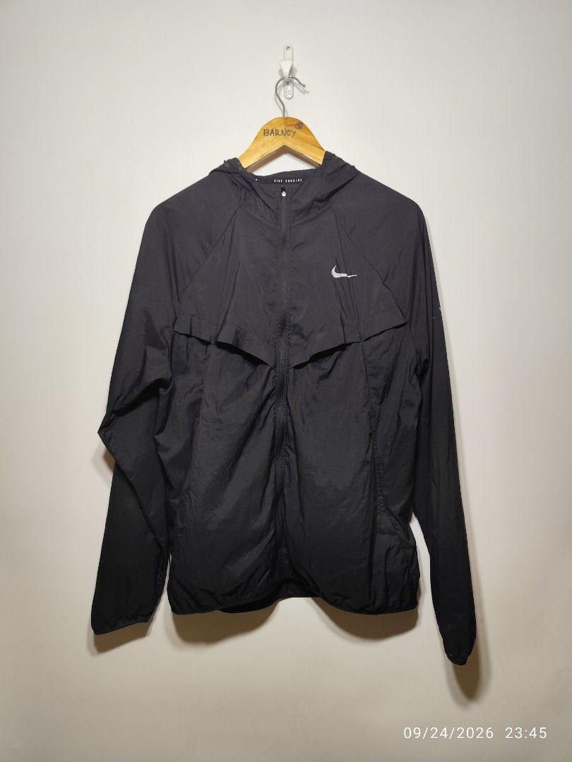 Nike Stride Men's Repel UV Running Jacket Black (Category: Activewear) located in San Fernando. Submitted by riasbarney67882 (Listing ID 1463915865, Image 1). Description: - Nike Stride running jacket in black - Size: L - Lightweight and water-repellent material - UV protection for sunny days - Attached hood - Reflective details on back and sleeves for enhanced visibility - Ideal for running, training, or everyday wear.