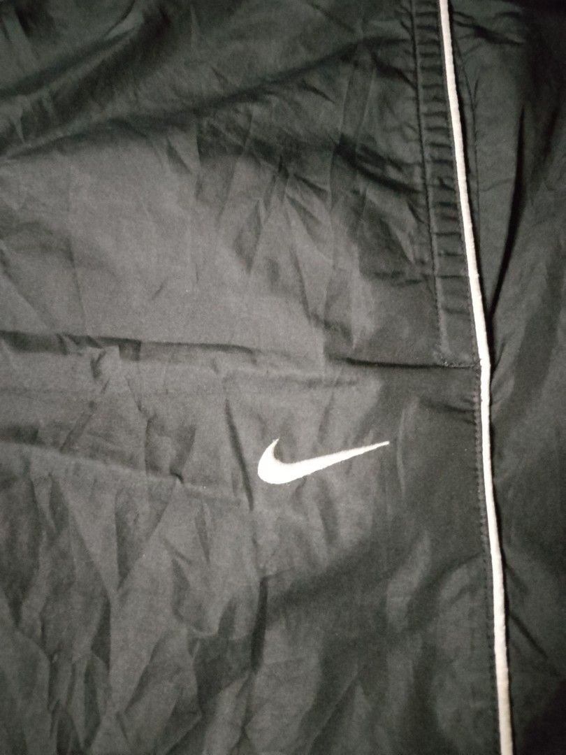 Nike Vintage 2007 Nylon Track Pants (Category: Activewear) located in Baguio. Submitted by bado.feels (Listing ID 1463874805, Image 2). Description: Color: Black Color rate: 9/10 Size 38 Length 38 Thigh 12 Leg opening 10 550+sf Baguio loc.