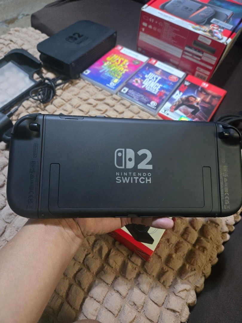 Nintendo switch 2 with games (Category: Nintendo) located in San Juan City. Submitted by lukapukus (Listing ID 1463768290, Image 3). Description: For sale lang po pass sa swap Selling nintendo switch 2 with games and complete accessories No issue tempered glass install day one smooth na smooth Box Dock Charger Hdmi cable(Rep) Joycon grip Strap Free case pouch and charging dock Games nasa account po lahat ng games can change email and password upo
