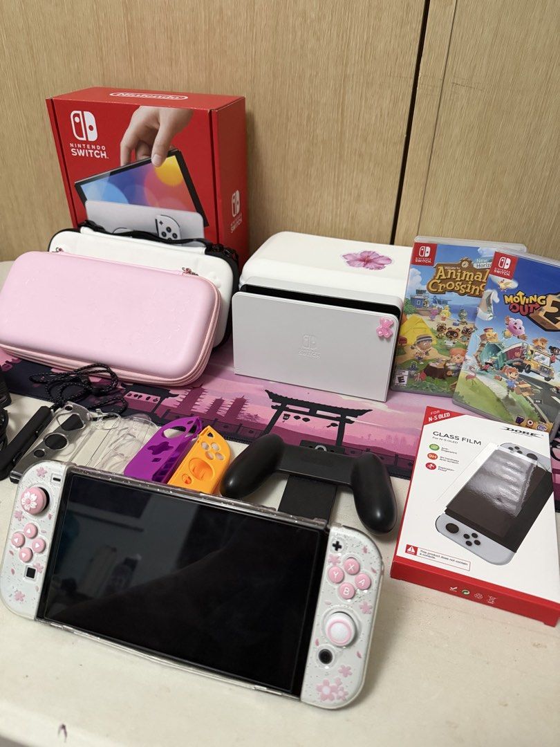 Nintendo Switch OLED + Games & Accessories Bundle (Category: Nintendo) located in Quezon City. Submitted by andyclave (Listing ID 1463903403, Image 2). Description: No defects or issues — complete and well-maintained. Includes original receipts from DataBlitz. Woman-owned. Purchased: June 2026 Warranty: Until June 2027 RFS: Need funds for meds. Inclusions * Nintendo Switch OLED * Animal Crossing: New Horizons * Moving Out 2 * Original Charger * O