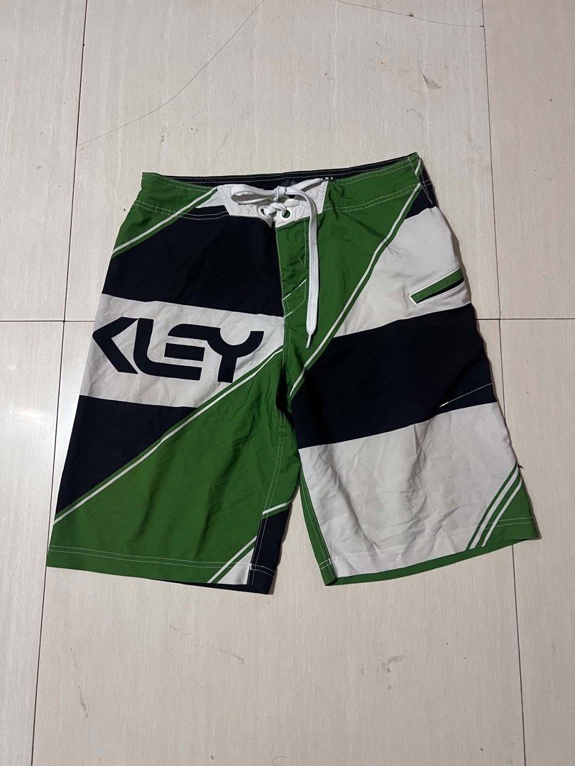 Oakley Board Shorts Green Black White (Category: Swim Trunks & Board Shorts) located in Manila. Submitted by sajidkhandaham (Listing ID 1463898557, Image 1). Description: - Oakley board shorts - Cool green, black, and white geometric design - Elastic waistband with drawstring for a secure fit - Side pocket with flap closure - Ideal for swimming, lounging, or your next adventure Add sf .