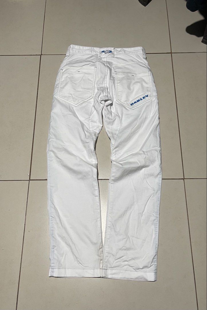 Oakley golf trousers (Category: Jeans) located in Manila. Submitted by john_robert00 (Listing ID 1463916947, Image 1). Description: Oakley golf trousers with a blue-accented side zipper pocket and articulated knees. No issue .