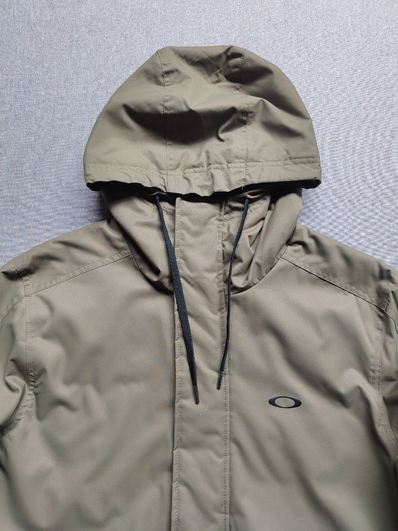 Oakley Parka Jacket (Olive Green) (Category: Coats, Jackets and Outerwear) located in Taguig. Submitted by _theroom.ph (Listing ID 1463908247, Image 2). Description: - Oakley hooded jacket in olive green - Full zip front closure - Two convenient front pockets - Quilted lining for added warmth - Adjustable drawstring hood and hem - Ideal for casual wear and outdoor adventures Oakley Parka Jacket (Olive Green) Size Large 30-33 x 23.5 (Fits XL) Exce