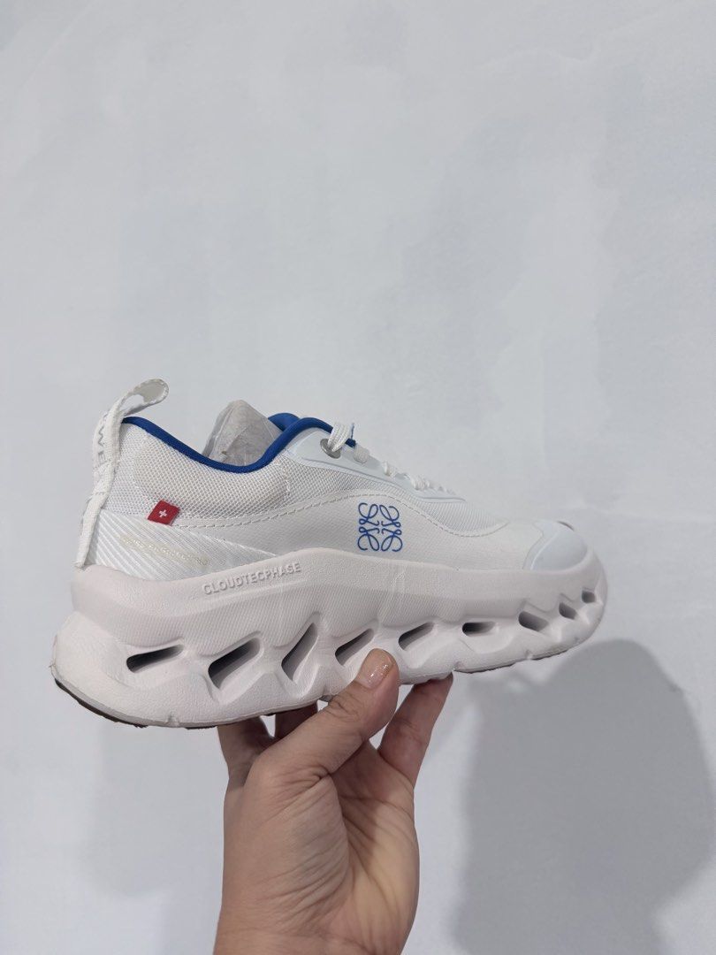 On Cloudtecphase Loewe Sneakers White Blue (Category: Sneakers) located in Davao. Submitted by ishtaranne (Listing ID 1463745291, Image 3). Description: - White and blue On Cloudtecphase sneakers - Features Loewe logo on the side - Lace-up closure for a secure fit - Designed for comfort and style - Ideal for everyday wear or light workouts - Grab these cool kicks!.