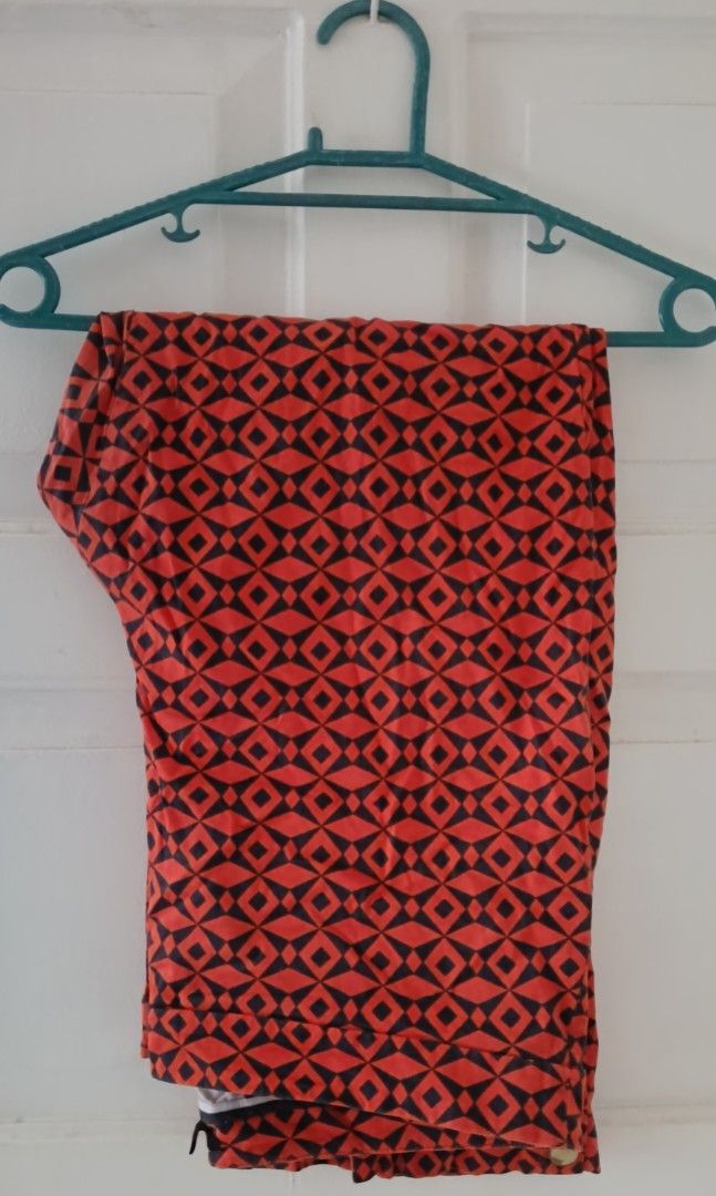 Orange and Black Geometric Pattern Pants with Button Detail size 40 (Category: Jeans) located in Paranaque City. Submitted by yesyesyo (Listing ID 1463813210, Image 1). Description: - Eye-catching orange and black geometric print - Trendy cropped length - Stylish button details on the side of the leg - Versatile for casual outfits - Easy to mix and match with your wardrobe -Width 20 inches - Length 40 inches this is not thrifted. all are for decl