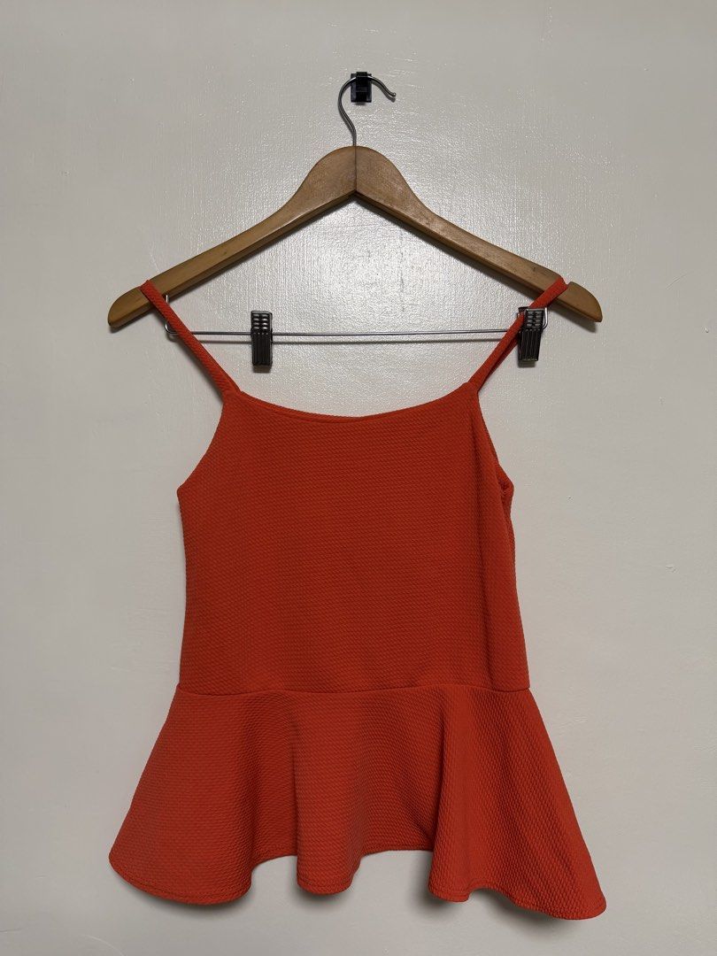 Orange Textured Peplum Camisole Top (Category: Sleeveless) located in Manila. Submitted by don_p (Listing ID 1463863018, Image 2). Description: XS to S - Chic orange camisole top with a flattering peplum hem. - Features a stylish textured fabric and delicate spaghetti straps. - Estimated size: Small to Medium (please check measurements if available). - Versatile piece: great for layering over or under other clothes, or wear it on its own. - Adds 