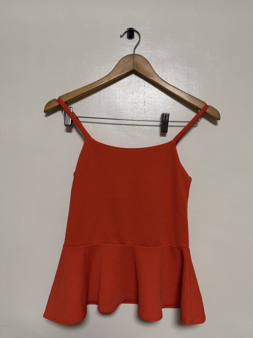 Orange Textured Peplum Camisole Top (Category: Sleeveless) located in Manila. Submitted by don_p (Listing ID 1463863018, Image 1). Description: XS to S - Chic orange camisole top with a flattering peplum hem. - Features a stylish textured fabric and delicate spaghetti straps. - Estimated size: Small to Medium (please check measurements if available). - Versatile piece: great for layering over or under other clothes, or wear it on its own. - Adds 