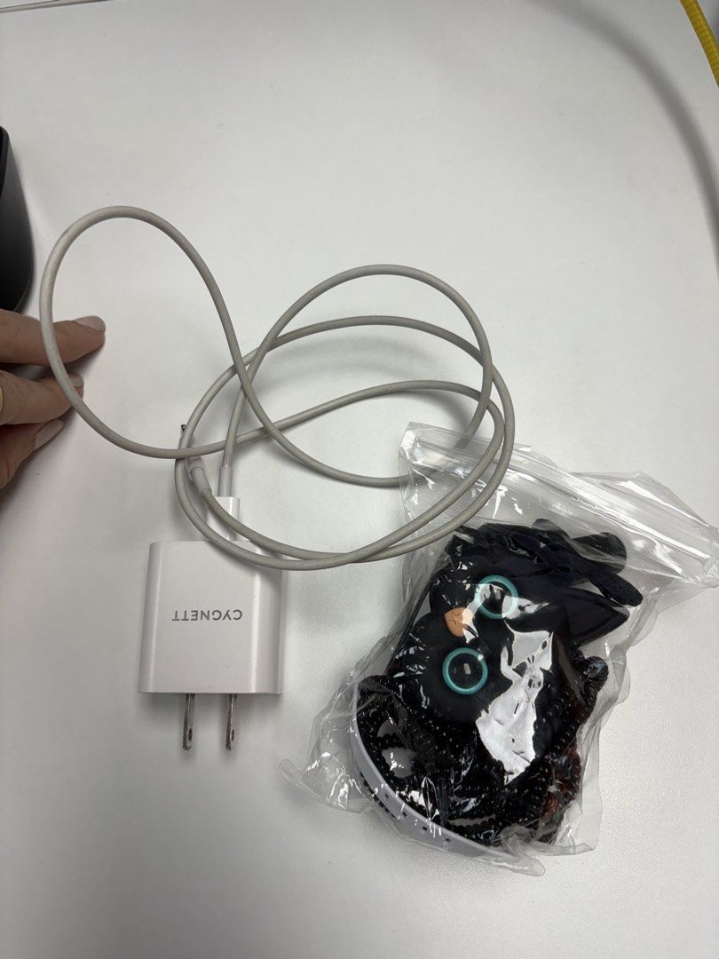 Original Apple lightening cable with plug box. Free charger protector (Category: Chargers & Cables) located in Makati City. Submitted by pamimaia (Listing ID 1463819849, Image 2). Description: - Original Apple Lightning cable and power adapter set. - Comes with a free cute charger protector. - Cable and adapter are white. - Charger adapter features 'CYGNETT' branding. - Meetup options available in Ortigas. .