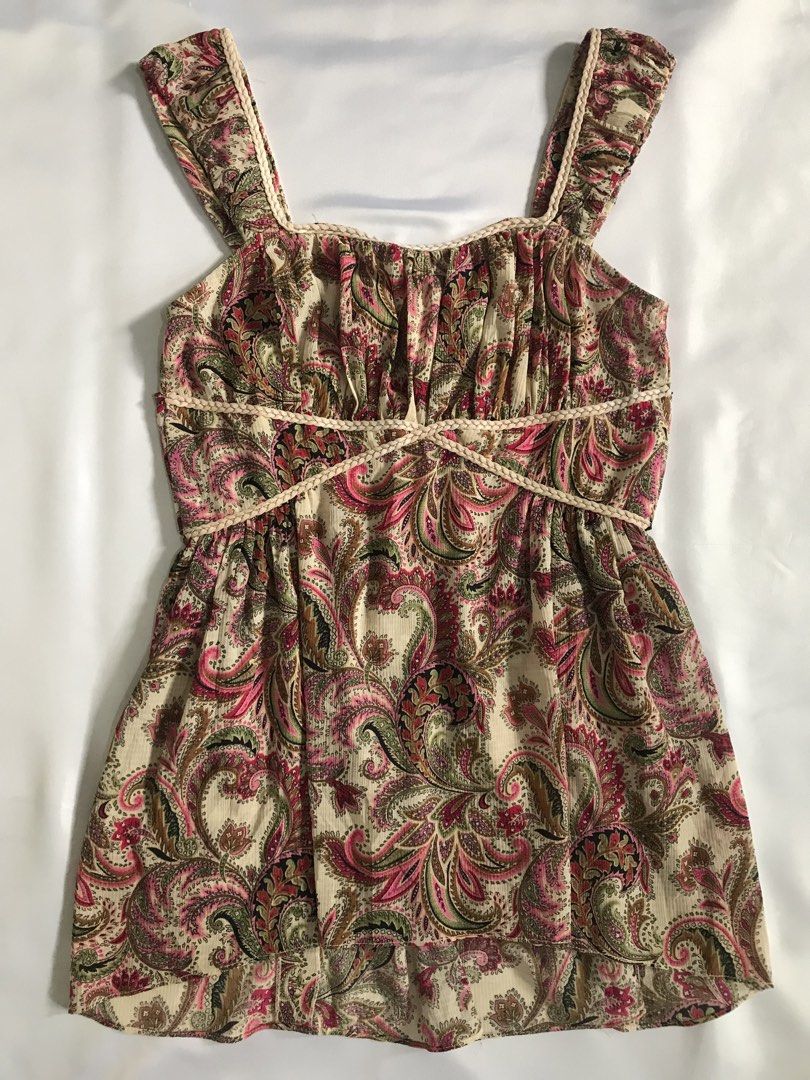 Paisley peplum top with tie-back straps (Category: Sleeveless) located in Davao. Submitted by mira_e02 (Listing ID 1463796757, Image 2). Description: With braided trim, and a flared hem. ~ Can fit to XS-M girlies, ~ Bust: 36 inch , ~ Length: 21 inch.