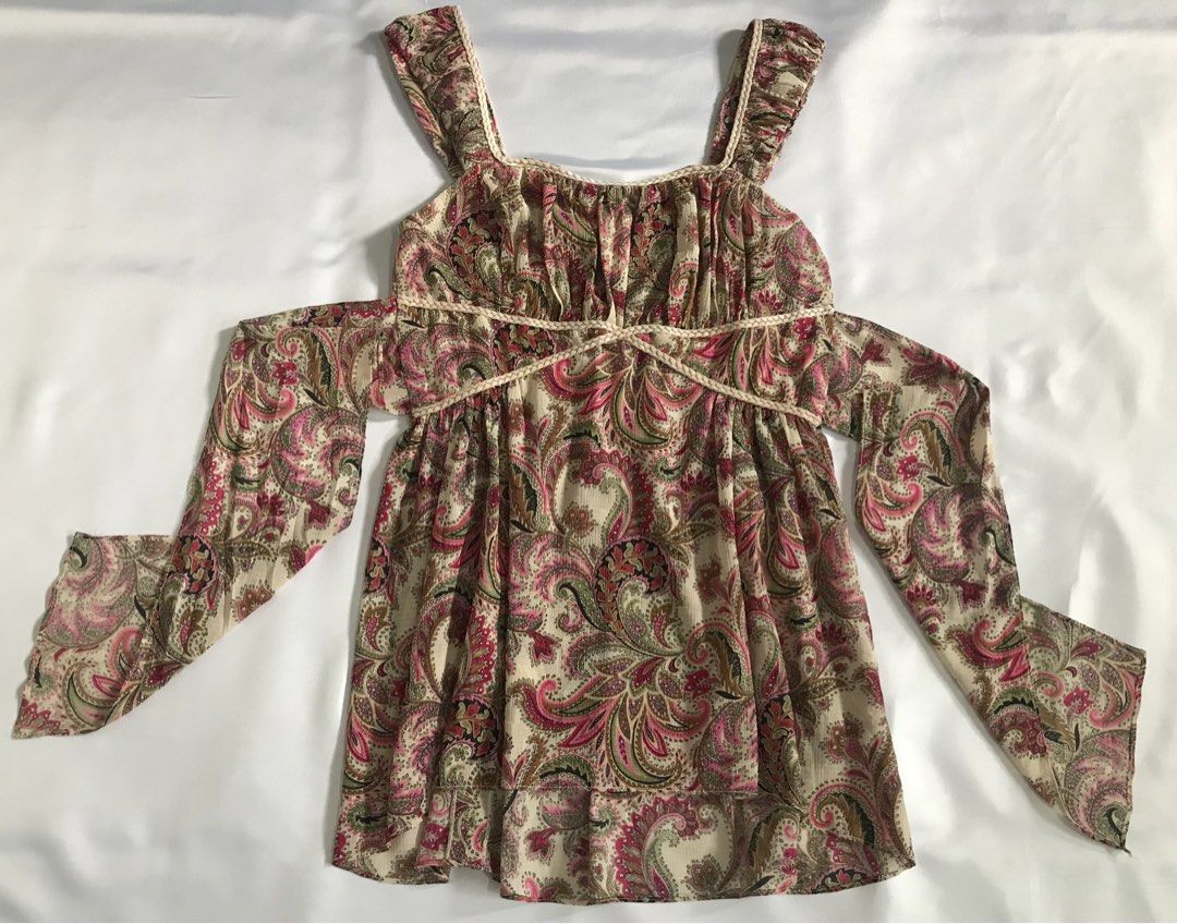 Paisley peplum top with tie-back straps (Category: Sleeveless) located in Davao. Submitted by mira_e02 (Listing ID 1463796757, Image 1). Description: With braided trim, and a flared hem. ~ Can fit to XS-M girlies, ~ Bust: 36 inch , ~ Length: 21 inch.
