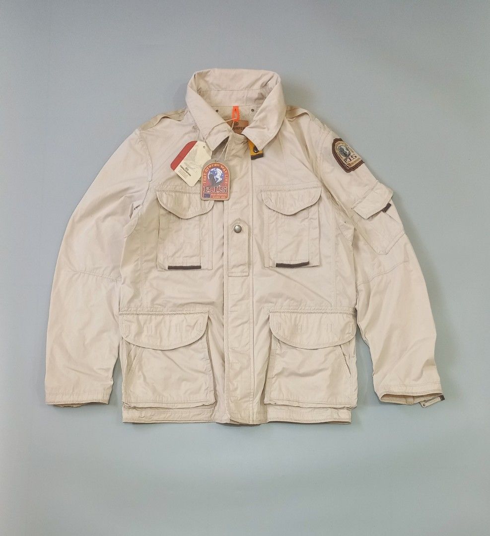 Parajumpers Masterpiece Series Beige Field Jacket (Category: Coats, Jackets and Outerwear) located in Cebu City. Submitted by MrLiks_123 (Listing ID 1463777005, Image 1). Description: - Beige Parajumpers field jacket from the Masterpiece Series. - Features multiple front pockets and a patch on the sleeve. - Attached hood for added protection. - Secure button and zip closure. - Estimated size: Large. - Ideal for outdoor adventures and everyday cas