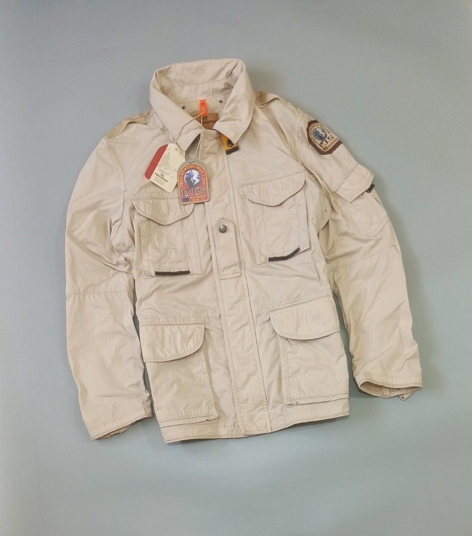 Parajumpers Masterpiece Series Beige Field Jacket (Category: Coats, Jackets and Outerwear) located in Cebu City. Submitted by MrLiks_123 (Listing ID 1463777005, Image 2). Description: - Beige Parajumpers field jacket from the Masterpiece Series. - Features multiple front pockets and a patch on the sleeve. - Attached hood for added protection. - Secure button and zip closure. - Estimated size: Large. - Ideal for outdoor adventures and everyday cas