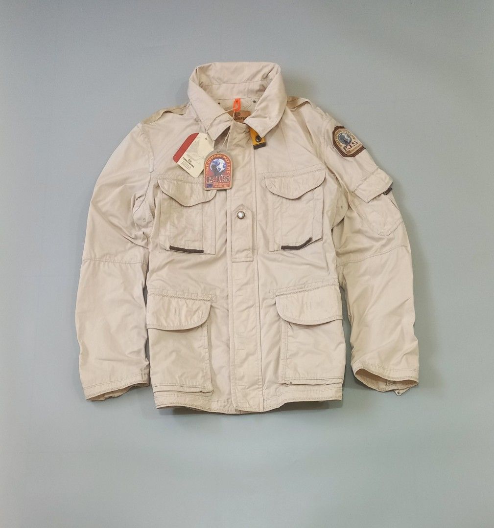 Parajumpers Masterpiece Series Beige Field Jacket (Category: Coats, Jackets and Outerwear) located in Cebu City. Submitted by MrLiks_123 (Listing ID 1463777005, Image 3). Description: - Beige Parajumpers field jacket from the Masterpiece Series. - Features multiple front pockets and a patch on the sleeve. - Attached hood for added protection. - Secure button and zip closure. - Estimated size: Large. - Ideal for outdoor adventures and everyday cas