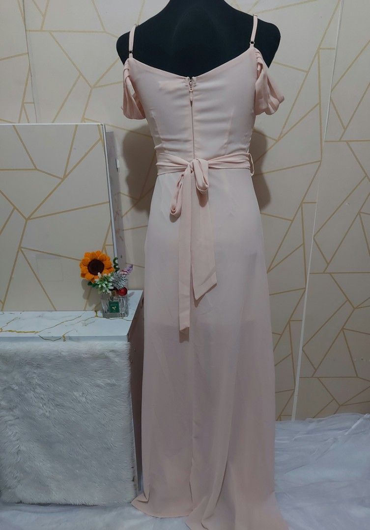 Peach Cold Shoulder Pleated Maxi Dress(small) (Category: Dresses) located in Manila. Submitted by jollyann_b1990 (Listing ID 1463812042, Image 2). Description: - Beautiful peach maxi dress - Cold shoulder design with short sleeves - Flattering V-neckline with pleated detailing - Cinched waist with a tie for a defined silhouette - Flowy skirt for graceful movement - Convenient back zipper closure - Ideal for events and formal occasions.