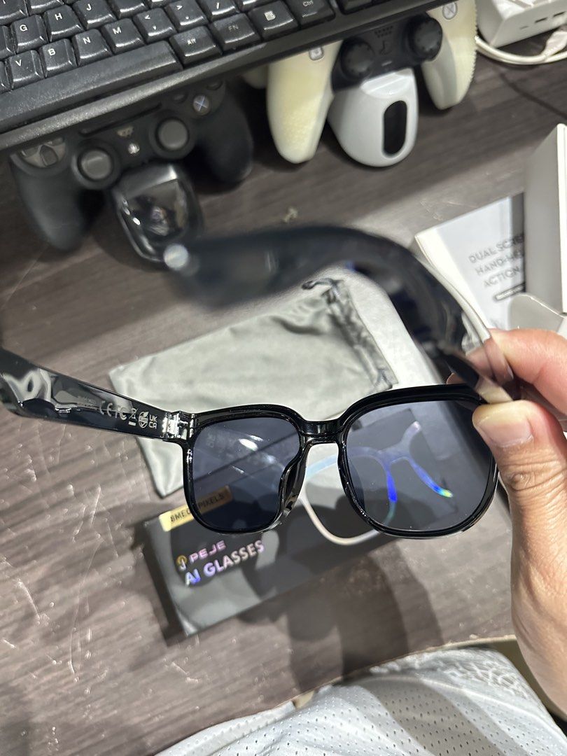 PEJE AI Glasses 8MP Camera (Category: Sunglasses & Eyewear) located in Pasig City. Submitted by brocode619 (Listing ID 1463768863, Image 3). Description: - PEJE AI Glasses with 8MP camera - Features: Real-time translation, photo capture, music playback, voice assistant - Battery: 290mAh (4-7 hours usage) - Compatibility: Android 5.4+ / iOS 9.0+ - Includes: Soft pouch - Perfect for hands-free recording and assistance.