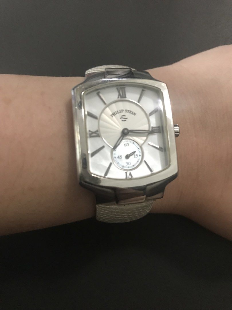 Philip Stein Watch White Dial (Category: Women's Watches) located in Mandaluyong City. Submitted by thegfstore (Listing ID 1463792065, Image 3). Description: - Philip Stein watch - White dial with small seconds subdial at 6 o'clock - Rectangular case - Light beige textured leather strap with buckle closure - Stylish and comfortable for everyday wear.