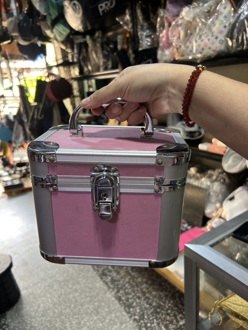 Pink and Silver Makeup Vanity Case with Handle and Lock (Category: Luxury Bags & Wallets) located in Manila. Submitted by starbalesukandjapansurplus (Listing ID 1463759974, Image 1). Description: - Adorable pink and silver makeup case - Features a sturdy handle for easy carrying - Secure lock closure to keep contents safe - Compact size, perfect for travel or everyday use - Great for storing makeup or small accessories.
