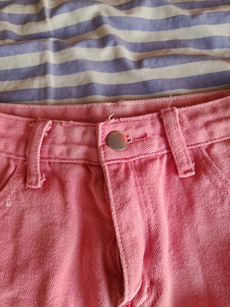 Pink Denim A-Line Mini Skirt (Category: Skirts) located in Manila. Submitted by tyrrachuuu (Listing ID 1463771816, Image 3). Description: - Cute pink denim skirt - A-line cut, mini length - Classic five-pocket styling - Button and zip front closure - Belt loops at waistband - Versatile: pairs well with t-shirts or crop tops - Ideal for casual outings or fun events - Bought from orange app, it says size Large on tag but I think it fits best for so