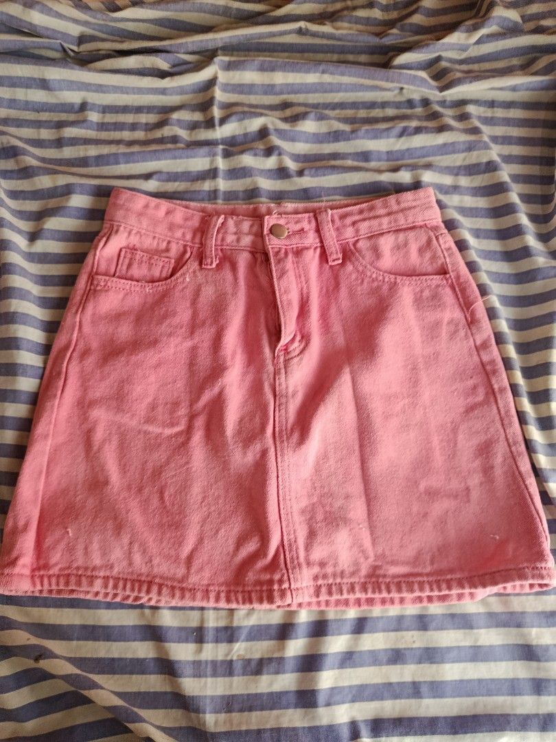 Pink Denim A-Line Mini Skirt (Category: Skirts) located in Manila. Submitted by tyrrachuuu (Listing ID 1463771816, Image 1). Description: - Cute pink denim skirt - A-line cut, mini length - Classic five-pocket styling - Button and zip front closure - Belt loops at waistband - Versatile: pairs well with t-shirts or crop tops - Ideal for casual outings or fun events - Bought from orange app, it says size Large on tag but I think it fits best for so