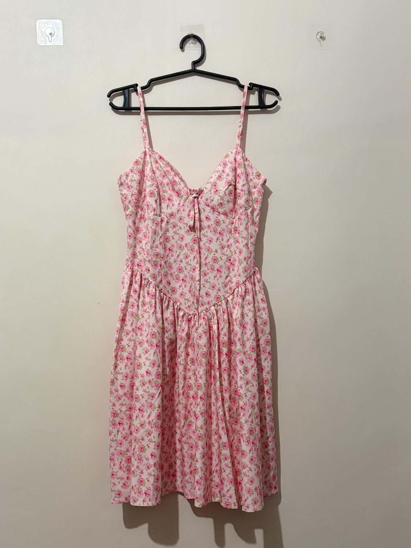 Pink Floral Spaghetti Strap Mini Dress (Category: Dresses) located in San Leonardo. Submitted by burgossanleonardo.12345 (Listing ID 1463913856, Image 1). Description: - Cute pink mini dress - Features a lovely floral print - Delicate spaghetti straps - Flattering tie detail at the bust - Flowy and gathered skirt for a breezy feel - Ideal for summer outings or casual events - Easy to style and wear.