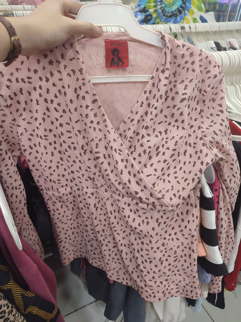 Pink Leopard Print Wrap Top by Emma (Category: Sleeveless) located in Jaen. Submitted by roxantiago (Listing ID 1463780275, Image 1). Description: - Cute pink top with a trendy brown leopard print. - Brand: Emma - Style: Wrap V-neck with long sleeves. - Versatile: Dress it up or down. - Perfect pairing: Looks great with jeans or skirts..