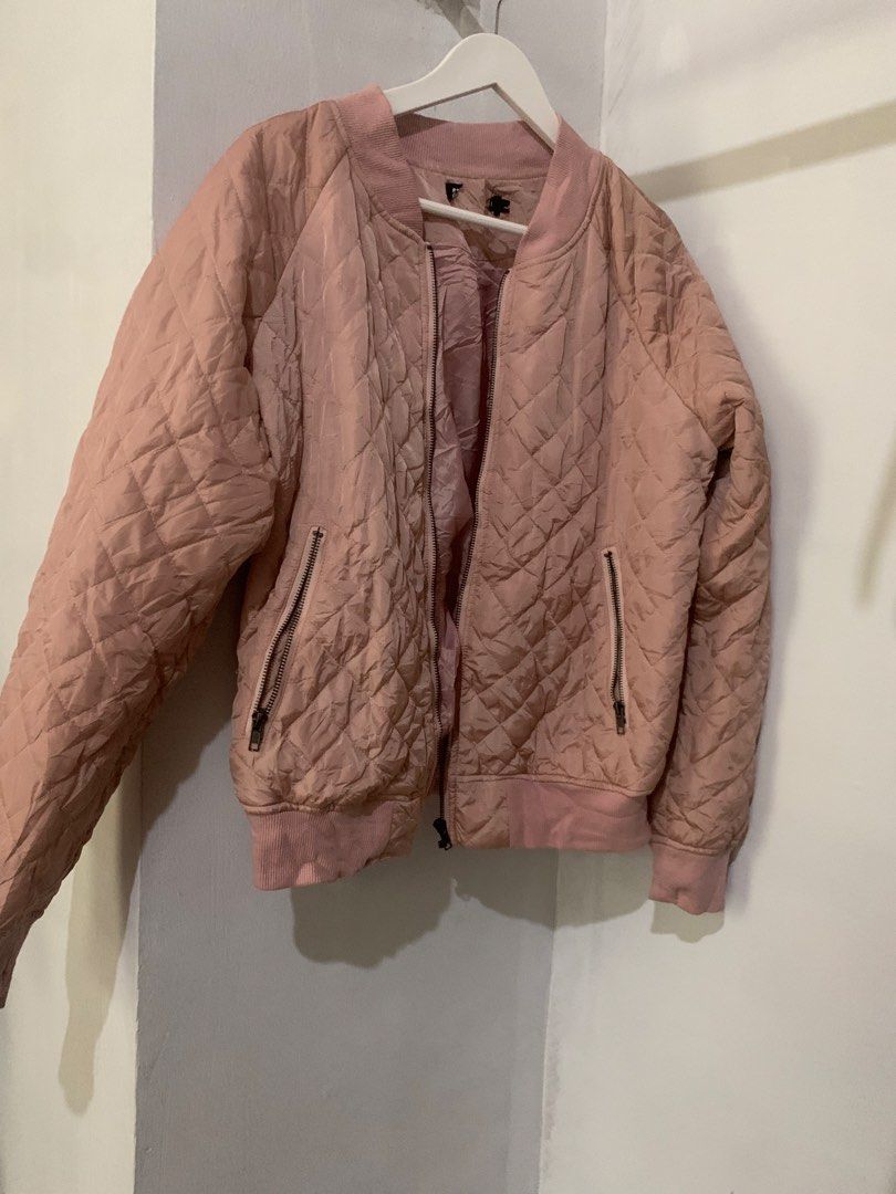 Pink Quilted Bomber Jacket (Category: Coats, Jackets and Outerwear) located in Manila. Submitted by spaceshop12345 (Listing ID 1463806839, Image 1). Description: - Light pink quilted bomber jacket - Zip-up front closure - Two side zip pockets - Ribbed collar, cuffs, and hem - Ideal for casual layering and easy styling.