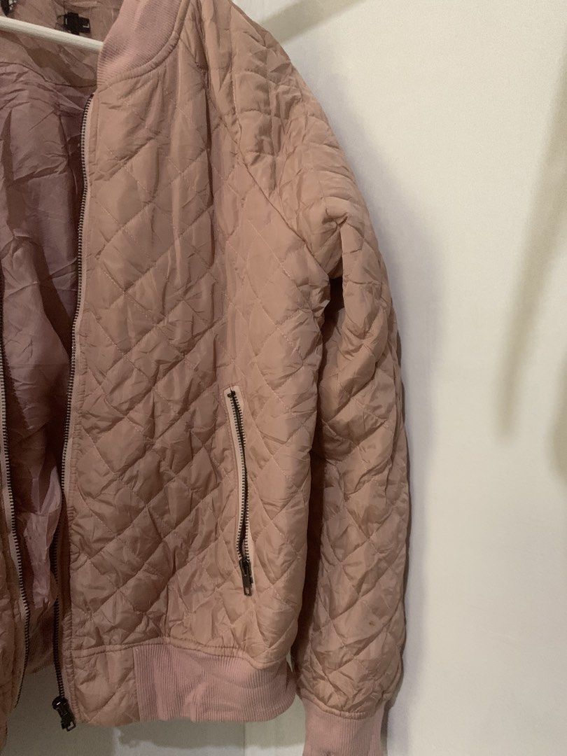 Pink Quilted Bomber Jacket (Category: Coats, Jackets and Outerwear) located in Manila. Submitted by spaceshop12345 (Listing ID 1463806839, Image 3). Description: - Light pink quilted bomber jacket - Zip-up front closure - Two side zip pockets - Ribbed collar, cuffs, and hem - Ideal for casual layering and easy styling.