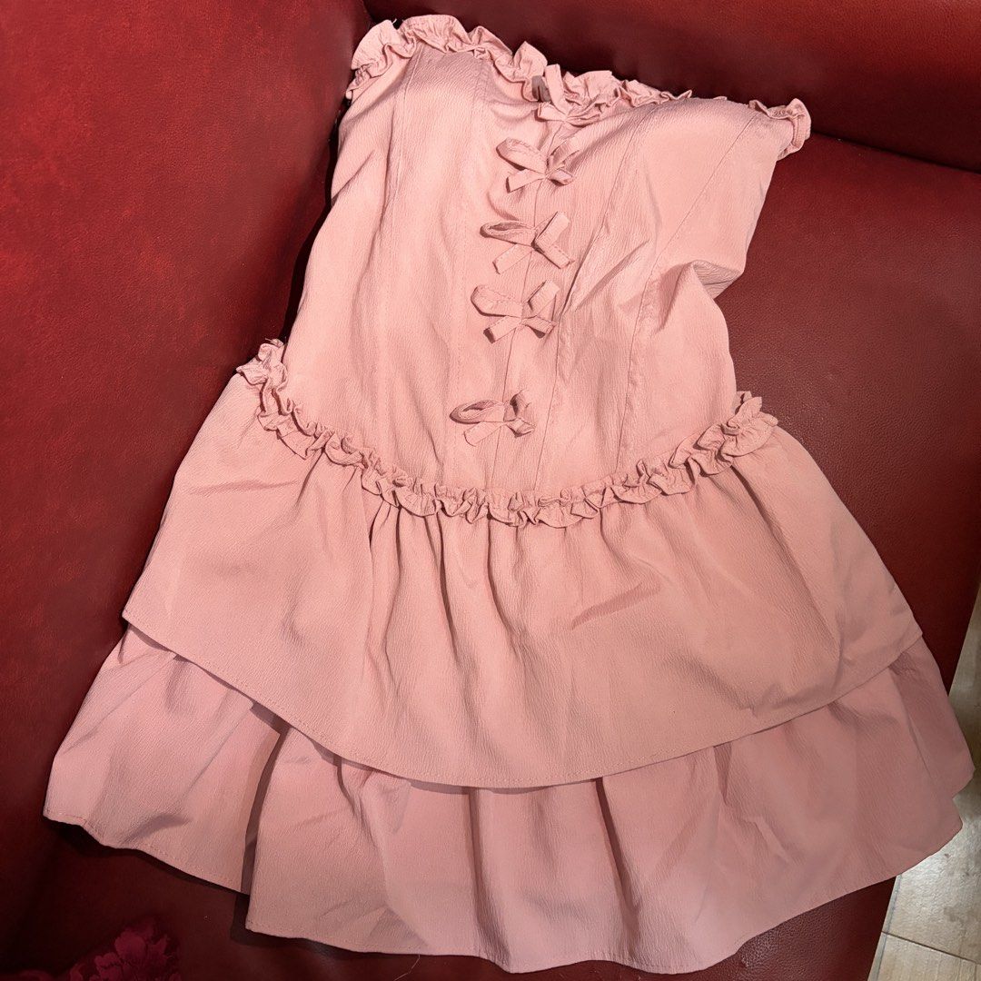 Pink ruffled dress with pads (Category: Dresses) located in Taytay. Submitted by murahubblueapppage (Listing ID 1463927270, Image 2). Description: Vietnam What you see is what you get Actual pic posted Free size But i think can fit xs to medium only Garter at the back Long: 24 inches .