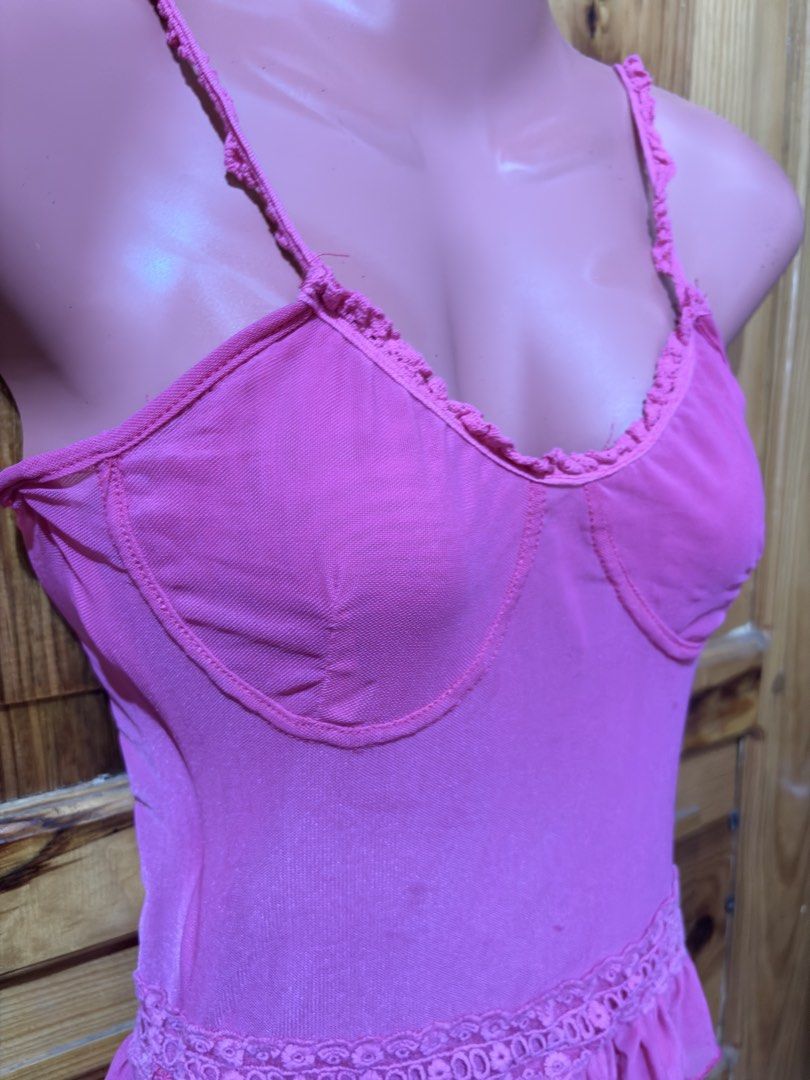 Pink Ruffled Mesh Bralette Top with Lace Trim (Category: Sleeveless) located in Baguio. Submitted by declutterbycys (Listing ID 1463821097, Image 2). Description: - Adorable pink top with ruffled mesh details. - Features adjustable straps for a perfect fit. - Decorative lace band at the waist. - Supportive design in the bust area. - Versatile: great for layering or wearing on its own. - Fun and flirty style..