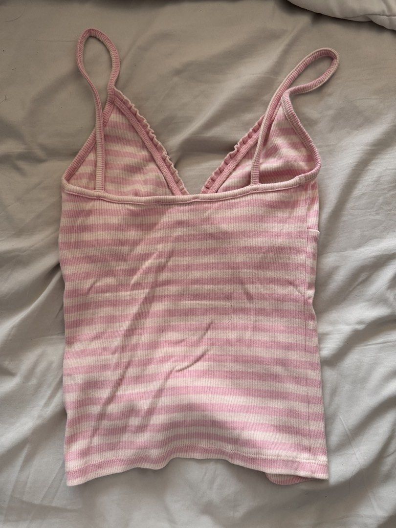 Pink Striped V Neck Tank Top (Category: Sleeveless) located in Pasig City. Submitted by lovedpicks (Listing ID 1463744514, Image 2). Description: - Brand: Bershka - Style: V-Neck Tank Top - Color: Pink and White Stripes - Fits XS-M! - Condition: Great - Features: Sleeveless, ribbed fabric.