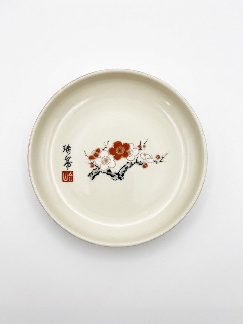 Plum blossom saucer (Category: Other Kitchenware & Tableware) located in Manila. Submitted by rlab_japan_thrift (Listing ID 1463845805, Image 1). Description: Japanese Vintage Plum Blossom (Ume) Ceramic Saucers / Mini Plates (Set of 4) 🌸🍶 An elegant 4-piece set of authentic Japanese porcelain small plates/saucers featuring hand-painted plum blossom (Ume) branches and classic calligraphy artist stamp details. Perfect as side dishes, soy sauce sa