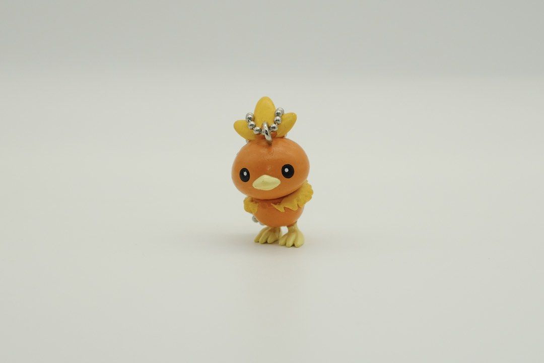 Pokemon BANDAI Torchic Charm Keychain (Category: Character Goods) located in Nasugbu. Submitted by achamocollects (Listing ID 1463769375, Image 1). Description: - Adorable Torchic charm from Pokemon - Comes with a keychain attachment - Ideal for decorating bags or keys - Small and collectible item.