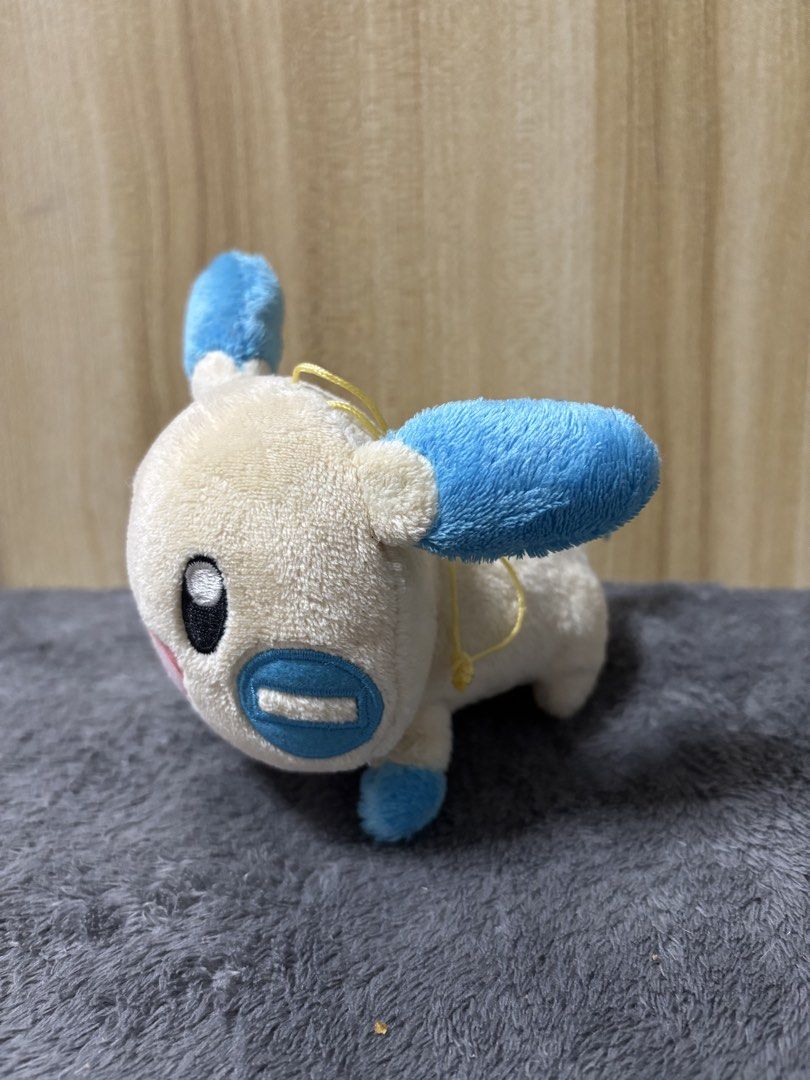 Pokemon MINUN Plush Toy (Category: Plushies & Soft Toys) located in Pasig City. Submitted by genyzk (Listing ID 1463811276, Image 3). Description: - Adorable Minun plush toy - Super soft and cuddly material - Features a yellow loop for easy hanging - Ideal gift for any Pokemon fan - Compact and portable size - In good, pre-loved condition.