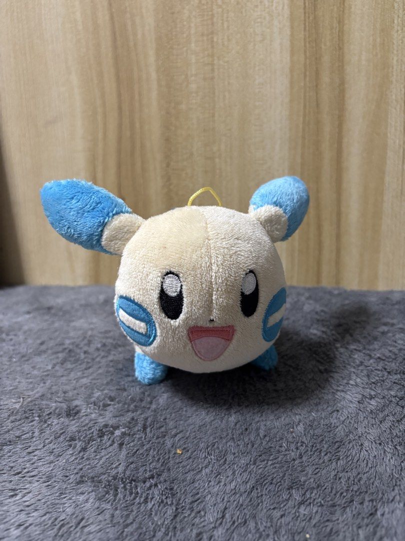 Pokemon MINUN Plush Toy (Category: Plushies & Soft Toys) located in Pasig City. Submitted by genyzk (Listing ID 1463811276, Image 2). Description: - Adorable Minun plush toy - Super soft and cuddly material - Features a yellow loop for easy hanging - Ideal gift for any Pokemon fan - Compact and portable size - In good, pre-loved condition.