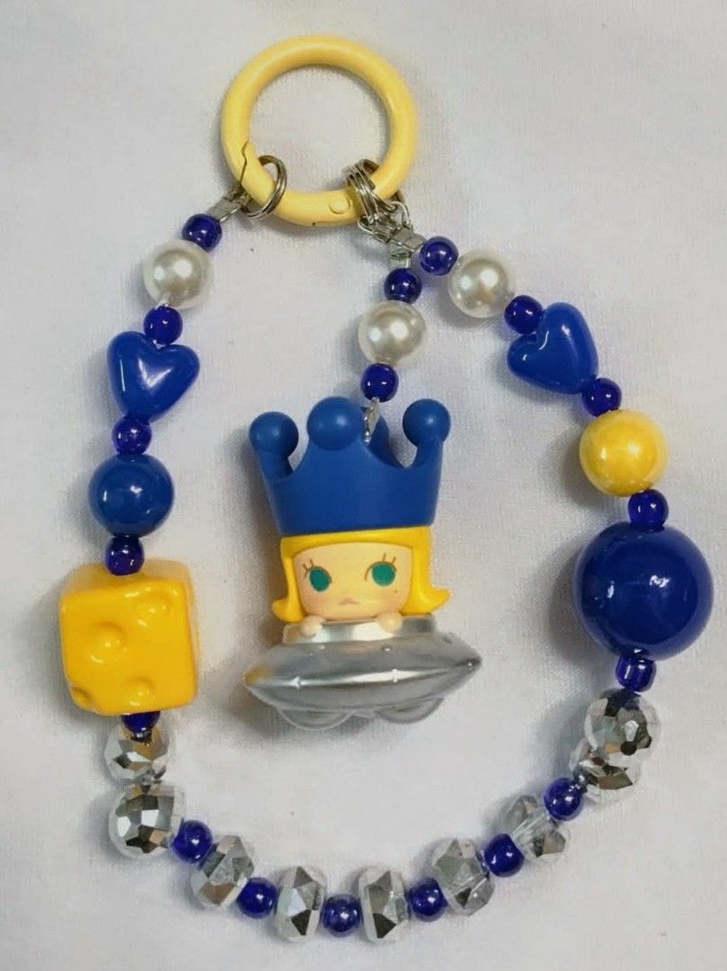 Popmart Molly Space Toy Charm with Beads (Category: Charms) located in Caloocan City. Submitted by jark_moonshop (Listing ID 1463841912, Image 1). Description: - Adorable Molly space toy keychain - Features blue and yellow beads - Includes pearl beads for a touch of elegance - Cute cheese charm accent - Comes with a yellow ring for easy attachment - Ideal for personalizing bags or keys.