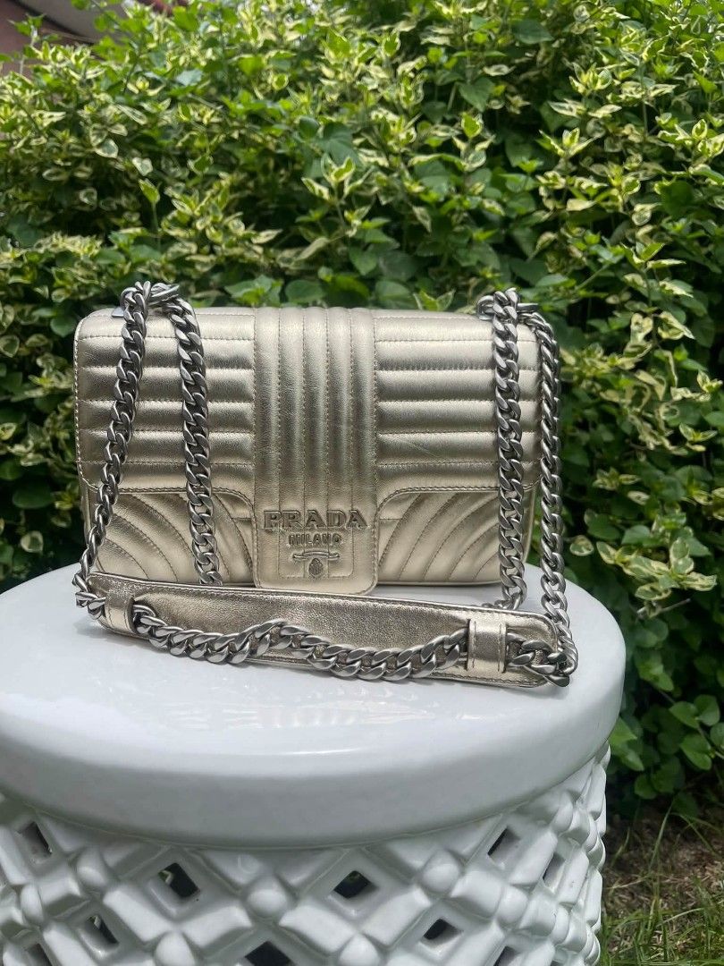 Prada Diagramme chain bag (Category: Luxury Bags & Wallets) located in Manila. Submitted by rangya (Listing ID 1463774183, Image 1). Description: - Metallic gold Prada shoulder bag - Classic quilted design - Silver chain strap - Prominent Prada Milano logo on front flap - Ideal for dressing up outfits.