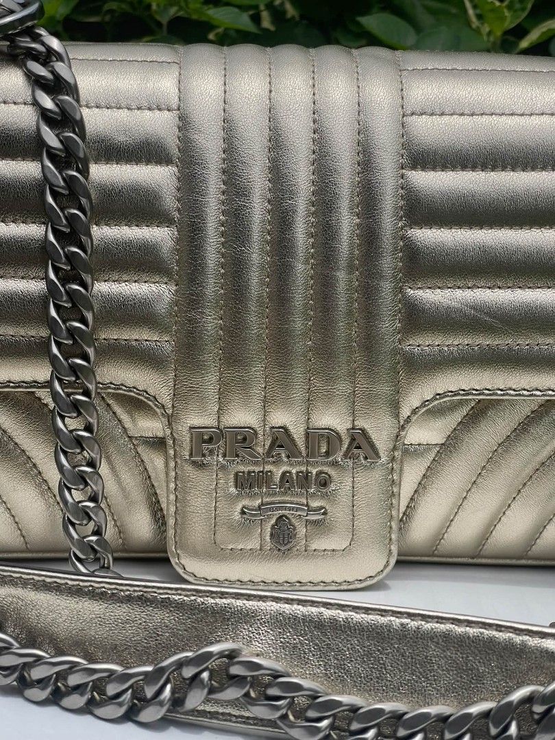 Prada Diagramme chain bag (Category: Luxury Bags & Wallets) located in Manila. Submitted by rangya (Listing ID 1463774183, Image 3). Description: - Metallic gold Prada shoulder bag - Classic quilted design - Silver chain strap - Prominent Prada Milano logo on front flap - Ideal for dressing up outfits.