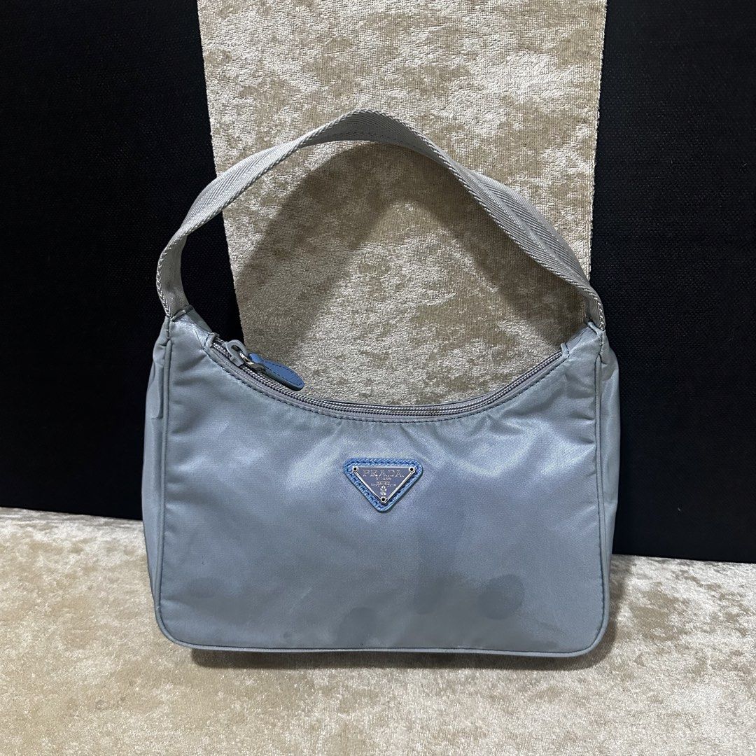 Prada Nylon Shoulder Bag Light Blue (Category: Luxury Bags & Wallets) located in Quezon City. Submitted by retroboominwantsummoh (Listing ID 1463844887, Image 1). Description: - Prada shoulder bag - Made in Italy - Classic light blue nylon material - Secure zipper closure - Interior features Prada branding and 'Made in Italy' tag - Small and compact, ideal for carrying essentials Japan surplus bought Needs wash Good condition 📩📩📩.