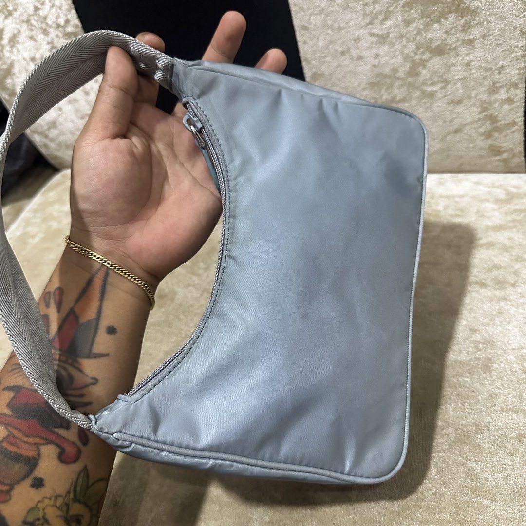 Prada Nylon Shoulder Bag Light Blue (Category: Luxury Bags & Wallets) located in Quezon City. Submitted by retroboominwantsummoh (Listing ID 1463844887, Image 3). Description: - Prada shoulder bag - Made in Italy - Classic light blue nylon material - Secure zipper closure - Interior features Prada branding and 'Made in Italy' tag - Small and compact, ideal for carrying essentials Japan surplus bought Needs wash Good condition 📩📩📩.