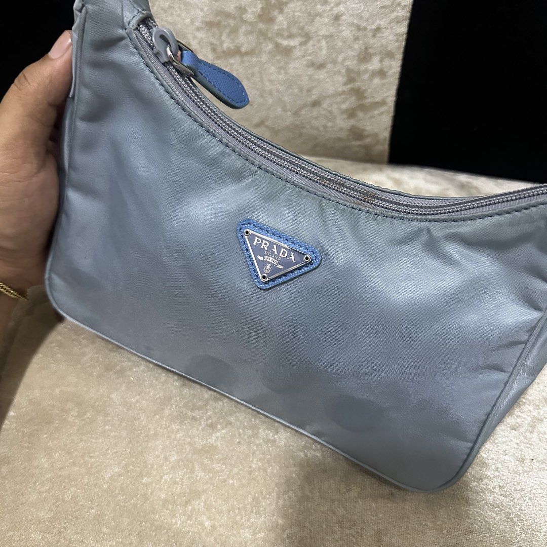 Prada Nylon Shoulder Bag Light Blue (Category: Luxury Bags & Wallets) located in Quezon City. Submitted by retroboominwantsummoh (Listing ID 1463844887, Image 2). Description: - Prada shoulder bag - Made in Italy - Classic light blue nylon material - Secure zipper closure - Interior features Prada branding and 'Made in Italy' tag - Small and compact, ideal for carrying essentials Japan surplus bought Needs wash Good condition 📩📩📩.