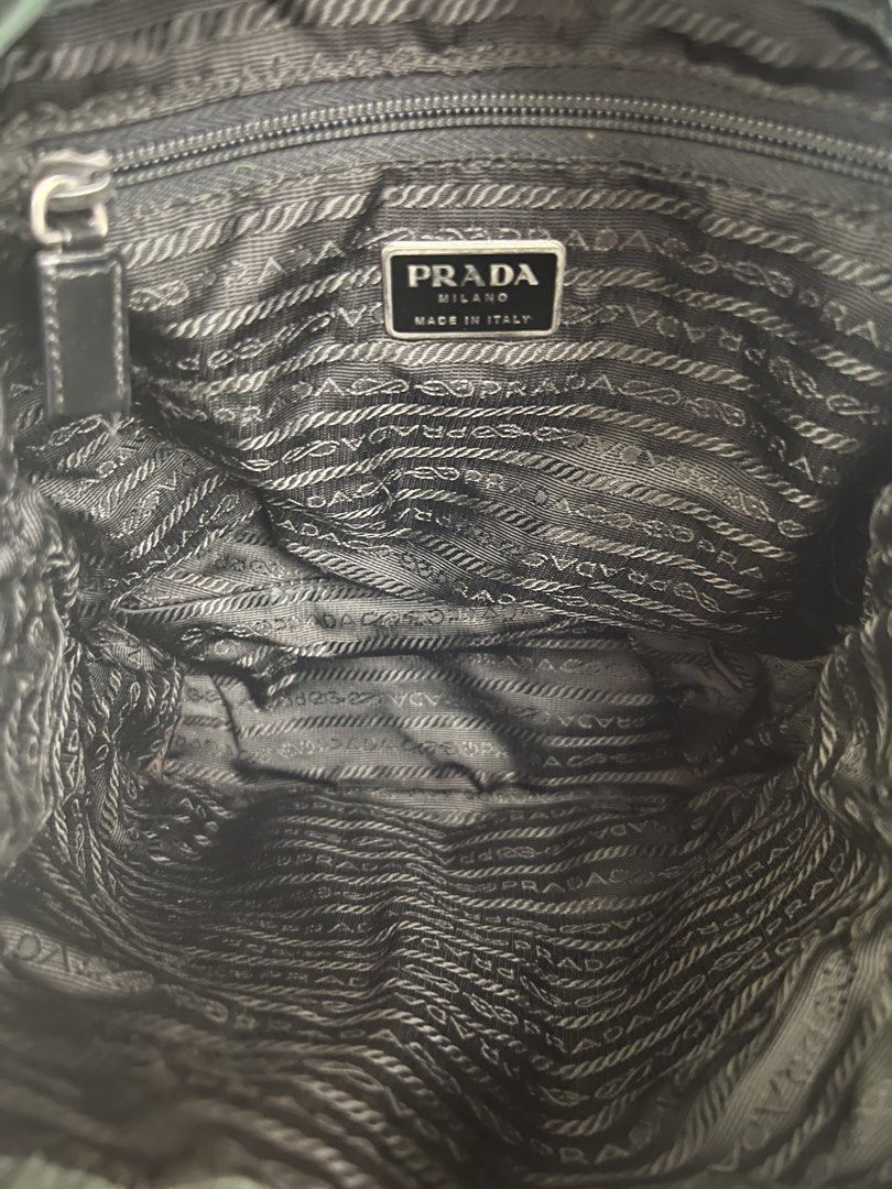 Vintage Prada Tessuto Nylon Backpack Green (Category: Backpacks) located in Manila. Submitted by pearlt455 (Listing ID 1463897950, Image 3). Description: - Authentic Vintage Prada Tessuto Nylon Backpack - Color: Dark Green - Material: Nylon with Leather Trim - Origin: Made in Italy - Closure: Drawstring with Buckle Flap - Interior: Prada logo lining - Y2K style; perfect for everyday wear .