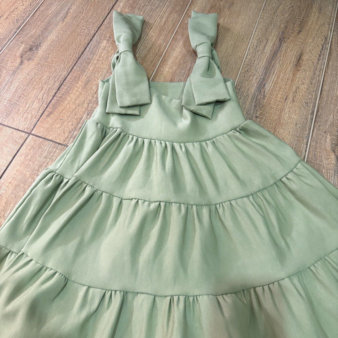 PRELOVE 4-5 (Category: Babies & Kids Fashion) located in Calauag. Submitted by cheannetan (Listing ID 1463935229, Image 1). Description: - Cute tiered dresses - Bow shoulder straps - Available colors: Red, Sage Green, White - Perfect for parties & special occasions - White dress: Ruffled hem - Sage Green & Red dresses: Tiered skirt - Sleeveless & comfortable fit.