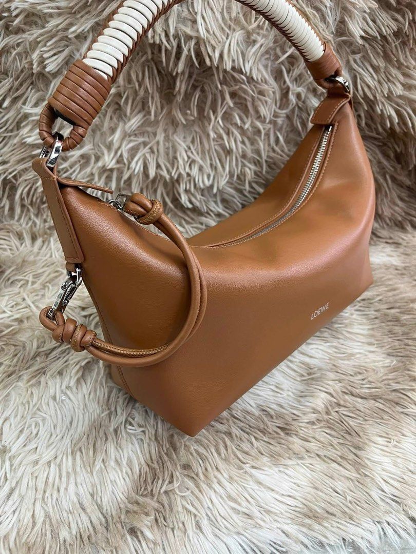 Preloved Cala Mini Mellow Nappa Lambskin Bag (Category: Cross-body Bags) located in Manila. Submitted by bagsandshoesmanymore (Listing ID 1463791102, Image 3). Description: Loewe Cala Mini Bag Mellow Color Mocha Shoulder, Crossbody or handcarry Rare to find Size 28cm Small Leather lining Zip closure with dog clip Emboroidered LOEWE Calfskin puller What you see is what you get.