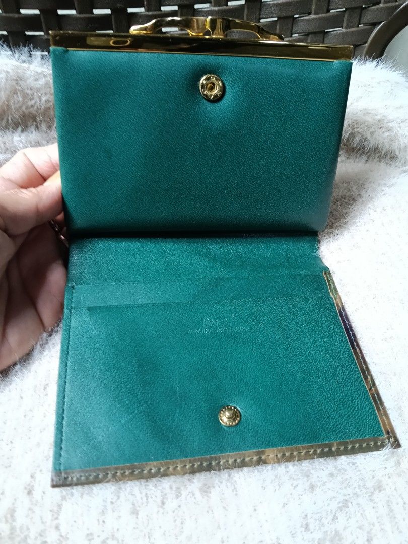 PRINCE Genuine Leather Embossed Floral Wallet (Category: Wallets & Card holders) located in Antipolo. Submitted by vastgem_4c8da8 (Listing ID 1463788227, Image 3). Description: - Vintage PRINCE wallet - Genuine leather with embossed floral design - Secure clasp closure - Multiple interior compartments - Deep green interior lining - Comes with original tags - Unique collectible piece.